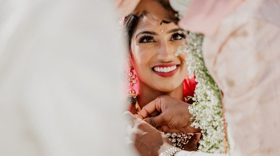 Indian bride looking at her groom during an hindu ceremony in the Greek Isle of Mykonos.